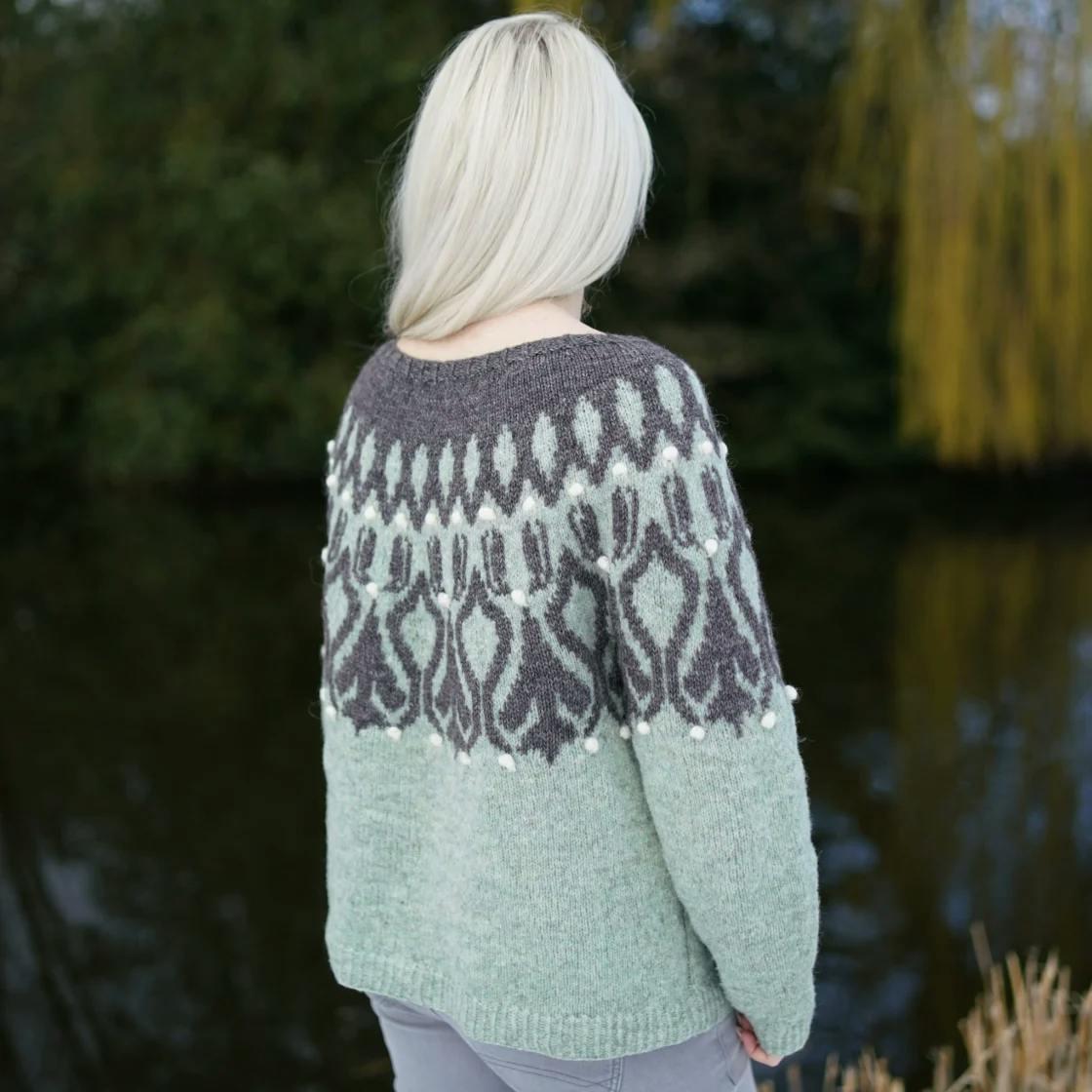 Back view of the Yoke Meditation Series No. 1 sweater in sage green and charcoal stranded colourwork with bobble accents.