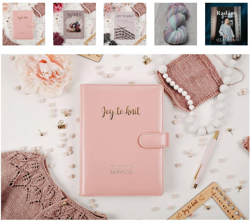 Pink Joy To Knit planner surrounded by hand-spun yarn, a Radam magazine and knitting accessories